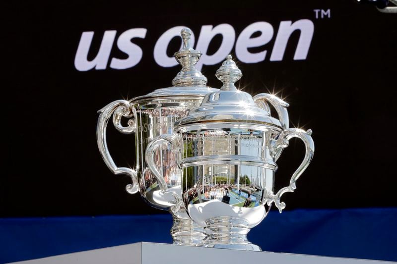 FILE - The winner's trophies are displayed during the reveal of the 2018 U.S. Open tennis tournament draw, in New York, Thursday, Aug. 23, 2018. The 2024 U.S. Open begins Monday, Aug. 26.(AP Photo/Richard Drew, File)