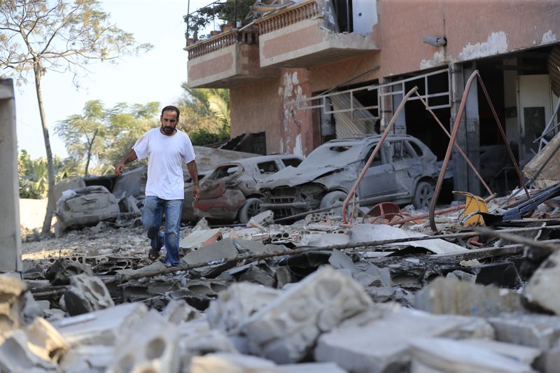 A man checks the damage to a building hit in an Israeli airstrike in the southern village of Akbieh, Lebanon, Tuesday, Sept. 24, 2024. (AP Photo/Mohammed Zaatari)