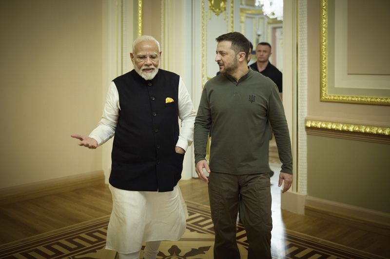 In this photo provided by the Ukrainian Presidential Press Office, shows Indian Prime Minister Narendra Modi, left, speaking with Ukrainian President Volodymyr Zelenskyy in Kyiv, Ukraine, Friday, Aug. 23, 2024. (Ukrainian Presidential Press Office via AP)