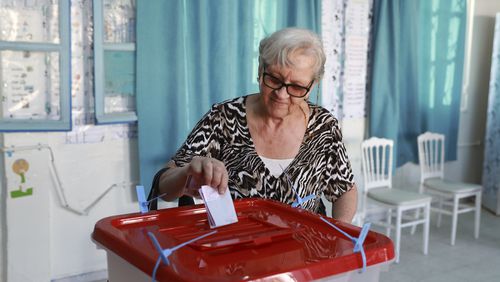 A Tunisian voter casts her ballot at a polling station during the presidential elections, in the capital Tunis, Tunisia, Sunday, Oct. 6, 2024. (AP Photo/Anis Mili)