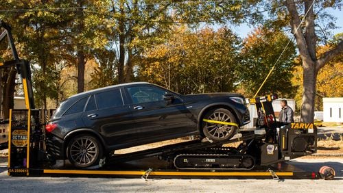 TARVA, a towing robot from France, tows a car onto a custom-designed towing truck at Tow Atlantaâs Scottsdale, Georgia, location on Thursday, Nov. 21, 2019. Tow Atlanta has been investing in technology such as the TARVA, the Tow Atlanta Recovery Vehicle Autobot, to assist with safely towing both luxury and ordinary cars in Atlanta. 
(Photo/Rebecca Wright for the Atlanta Journal-Constitution)