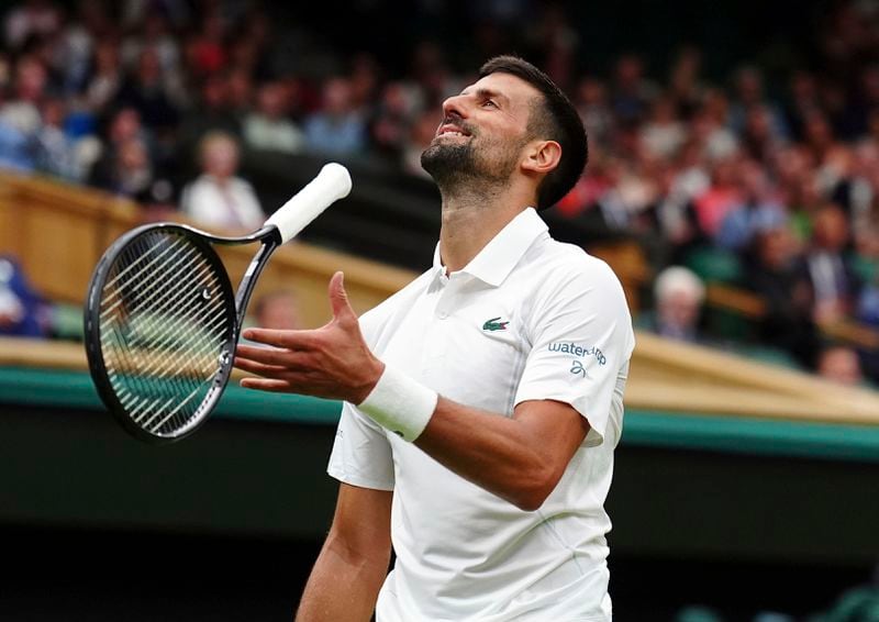 Serbia's Novak Djokovic reacts during his match against Vit Kopriva of the Czech Republic on their first round match at the Wimbledon tennis championships in London, Tuesday, July 2, 2024. (Mike Egerton/PA via AP)