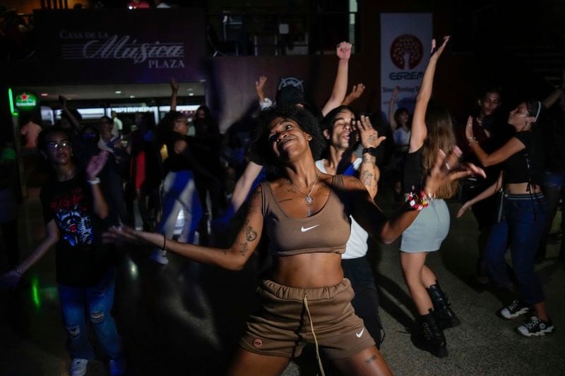 Karla Piña Costa dances with other teenagers to K-pop, popular Korean music, at a cultural house in Havana, Cuba, Saturday, Sept. 7, 2024. (AP Photo/Ramon Espinosa)