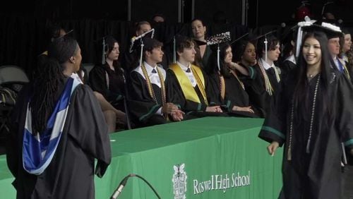 A Roswell High School student receives her degree during the 2024 commencement ceremony. (Courtesy of Fulton County Schools)