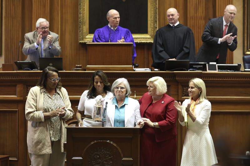 South Carolina's Sister Senators, from left, Sen. Margie Bright Matthews, D-Walterboro, Sen. Mia McLeod, I-Columbia, Sen. Katrina Shealy, R-Lexington, Sen. Penry Gustafson, R-Camden, and Sen. Sandy Senn, R-Charleston, stand in front of the Senate with their John F. Kennedy Profile in Courage award on Wednesday, June 26, 2024, in Columbia, S.C. The three Republican women Sister Senators were all voted out in their party's primary. (AP Photo/Jeffrey Collins)