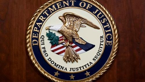 FILE - The seal of the Department of Justice, Aug. 1, 2023, at the Department of Justice in Washington. (AP Photo/J. Scott Applewhite, File)