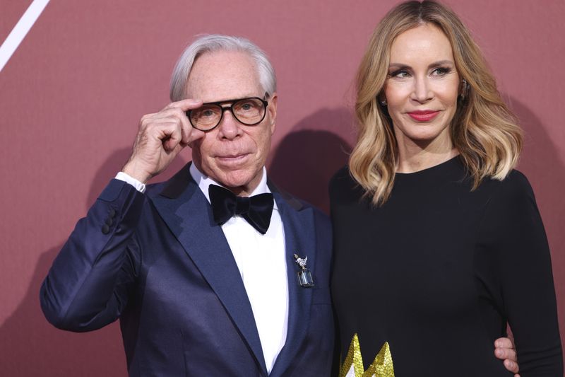 Tommy Hilfiger, left, and Dee Ocleppo pose for photographers upon arrival at the amfAR Cinema Against AIDS benefit at the Hotel du Cap-Eden-Roc, during the 77th Cannes international film festival, Cap d'Antibes, southern France, Thursday, May 23, 2024. (Photo by Vianney Le Caer/Invision/AP)