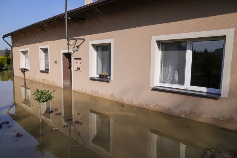 Zuzana Kublova's family home is flooded, in Bohumin, Czech Republic, Tuesday, Sept. 17, 2024. (AP Photo/Darko Bandic)