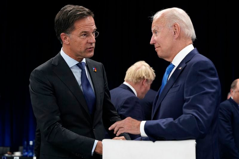 FILE - Netherland's Prime Minister Mark Rutte, left, speaks with U.S. President Joe Biden during a round table meeting at a NATO summit in Madrid, Spain, June 29, 2022. Over the course of more than a dozen years at the top of Dutch politics, Mark Rutte got to know a thing or two about finding consensus among fractious coalition partners. Now he's going to bring the experience of leading four Dutch multiparty governments to the international stage as NATO's new secretary general. (AP Photo/Susan Walsh, Pool, File)