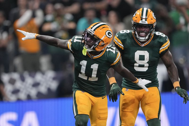 Green Bay Packers wide receiver Jayden Reed (11) celebrates after scoring against the Philadelphia Eagles during the first half of an NFL football game, Friday, Sept. 6, 2024, at the Neo Quimica Arena in Sao Paulo. (AP Photo/Doug Benc)