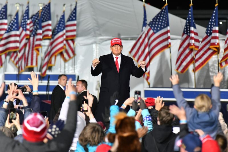 The close relationship between Donald Trump, shown dancing at a March rally in Commerce, and state GOP Chairman David Shafer has put the party boss at odds with Gov. Brian Kemp and other Republican leaders who top the former president's revenge list following his loss in Georgia in 2020. (Hyosub Shin / Hyosub.Shin@ajc.com)