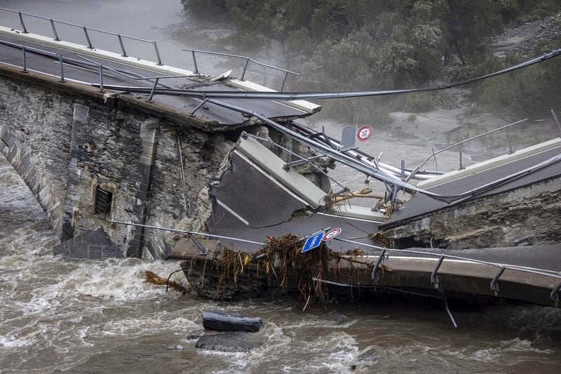 The bridge in Visletto destroyed due to the storm, in Visletto, in the Maggia Valley, southern Switzerland on Sunday June 30, 2024. The storm in the night from Saturday to Sunday destroyed various traffic routes. Following the landslide in the Maggia Valley, rescuers recovered two bodies on Sunday. One person is still missing, according to the Ticino cantonal police in Valle Maggia. (Michael Buholzer/Keystone via AP)
