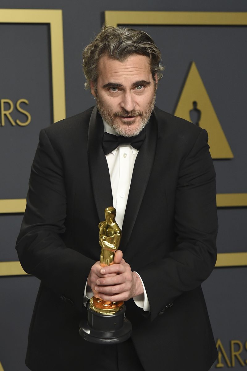 FILE - Joaquin Phoenix, winner of the award for best performance by an actor in a leading role for "Joker", poses in the press room at the Oscars on Sunday, Feb. 9, 2020, at the Dolby Theatre in Los Angeles. (Photo by Jordan Strauss/Invision/AP, File)