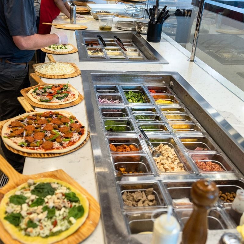 Employees at Your Pie keep each pizza separate and wear gloves to assemble the toppings. (Courtesy of Your Pie)