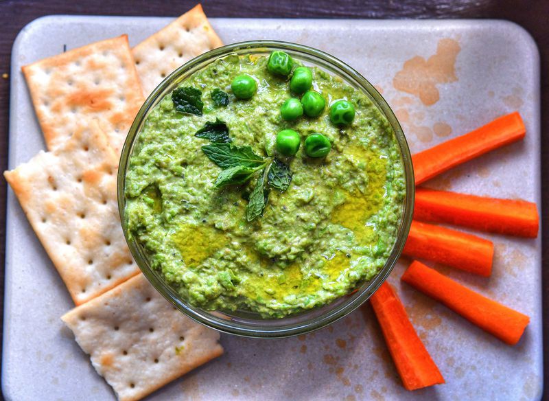 Sweet Pea and Sun Butter Hummus comes from a recipe in Lauren Angelucci McDuffie’s “Smoke, Roots, Mountain, Harvest” (Chronicle, $29.95). STYLING BY SUSAN PUCKETT / CONTRIBUTED BY CHRIS HUNT PHOTOGRAPHY