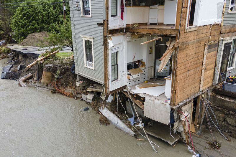 FILE - The remains of an apartment building are visible in Plainfield, Vt., July 12, 2024, after floodwaters and debris from the aftermath of Hurricane Beryl pulled several apartments into the Great Brook waterway. (AP Photo/Ted Shaffrey, File)