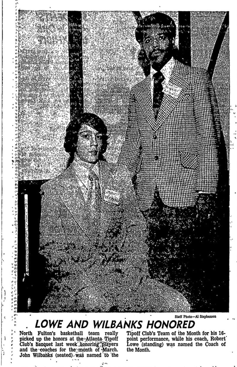 Robert Lowe became the first Black basketball coach at the mostly white North Fulton High School in the early 1970s. He was honored as Coach of the Month in 1974, as shown in this March 13 clip from the Atlanta Journal. John Wilbanks (seated) was one of Lowe's players, and was honored at the same event. (AJC archives)