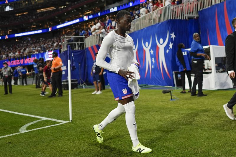 Tim Weah of the United States leaves the field after receiving a red card during a Copa America Group C soccer match against Panama in Atlanta, Thursday, June 27, 2024. (AP Photo/Mike Stewart)