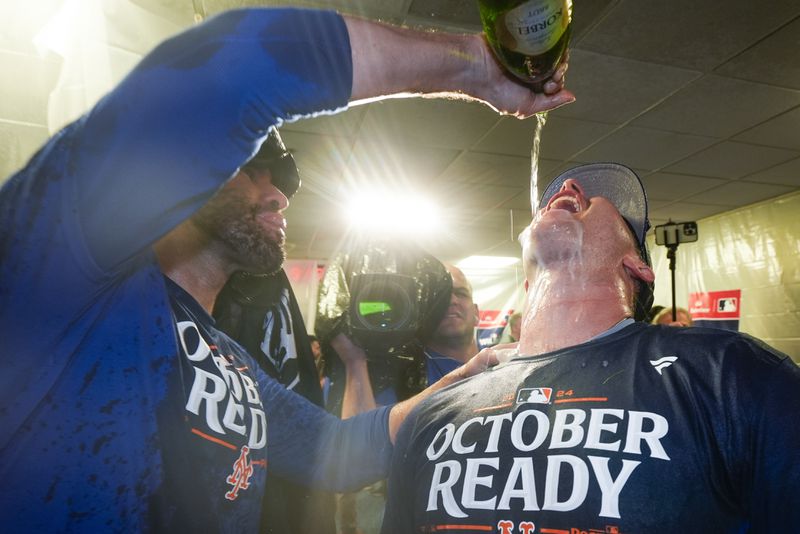 New York Mets' J.D. Martinez and Pete Alonso celebrate after winning Game 3 of a National League wild card baseball game against the Milwaukee Brewers Thursday, Oct. 3, 2024, in Milwaukee. The Mets won 4-2. (AP Photo/Morry Gash)