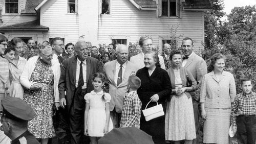 Left to right: Elizabeth Garst, Roswell Garst, Nikita Khrushchev, Nina Khrushchev and daughters Julia and Randa Khrushchev, stand in front of the Garst home during Krushchev's visit, Sept. 23, 1959, in Coon Rapids, Iowa. Elizabeth Garst, front left, then 8 years old, is now turning her grandparents farmhouse into a bed and breakfast.