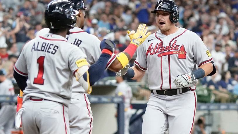 Austin Riley of the Atlanta Braves hits a triple during the third