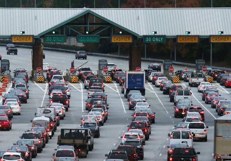 Ga. 400 has been toll-free since 2013. When the express lane project is complete in early 2031, the tolls will return but they'll look different than in the past. Toll booths aren't coming back, and using the express lanes is optional. Drivers with a Peach Pass can use the lanes and will pay variable rates by segment. Drivers who don't want to pay extra can continue to use the existing lanes. (Bob Andres/AJC)