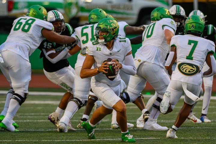 Buford quarterback Dayton Raiola looks to make a pass. (Jamie Spaar for the Atlanta Journal Constitution)