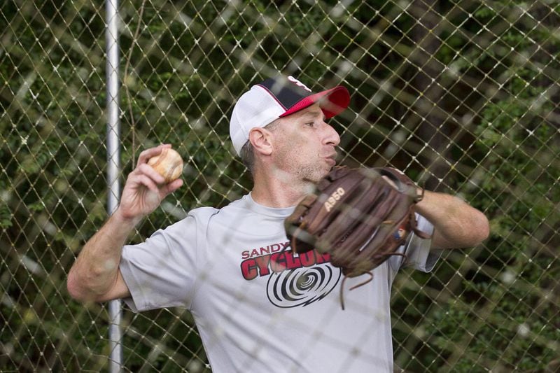 Andy Lipman has found balance in his life while living with cystic fibrosis. Here, he pitches a ball during practice for the Sandy Springs Cyclones Little League team at the Morgan Falls Athletic Fields. ALYSSA POINTER / ALYSSA.POINTER@AJC.COM