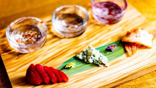 The sake flight pairing No. 1 at Chirori has three 1 1/2-ounce pours and three sweet and savory nibbles. CONTRIBUTED BY HENRI HOLLIS