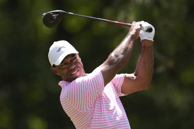 Tiger Woods watches his tee shot on the fifth hole during the first round of the U.S. Open golf tournament Thursday, June 13, 2024, in Pinehurst, N.C. (AP Photo/George Walker IV)
