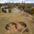 A portrait of Rosalynn and Jimmy Carter made from mulch, peat moss and stones sits on a hill in Freedom Park in Atlanta on Wednesday, Nov. 22, 2023.   (Ben Gray / Ben@BenGray.com)