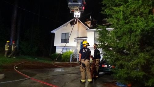 Fire crews respond to a house fire caused by lightning in Lilburn.