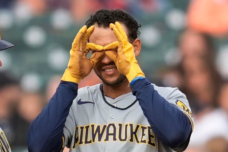Milwaukee Brewers' Blake Perkins (16) reacts to hitting a one-run triple against the Detroit Tigers in the second inning of a baseball game, Friday, June 7, 2024, in Detroit. (AP Photo/Paul Sancya)