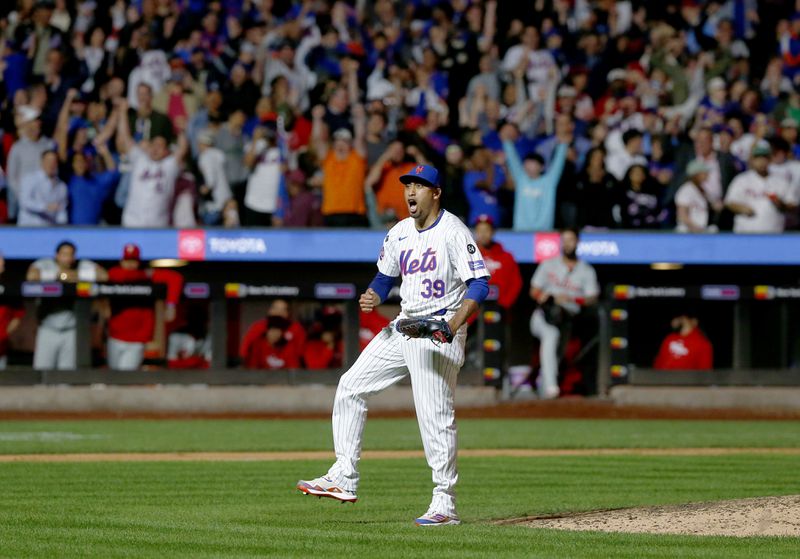 New York Mets relief pitcher Edwin Diaz reacts after striking out Kody Clemens for the final out during a baseball game against the Philadelphia Phillies, Sunday, Sept. 22, 2024, in New York. (AP Photo/John Munson)