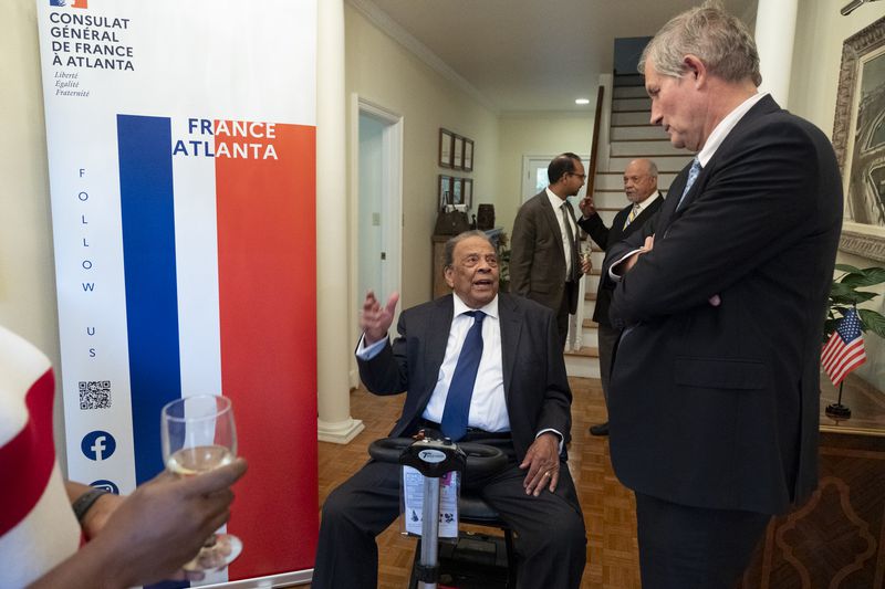 Ambassador Andrew Young talks with French Ambassador to the U.S. Laurent Bili before receiving the French Legion of Honor medal in Atlanta on Thursday, Oct. 19, 2023.   (Ben Gray / Ben@BenGray.com)