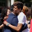Lashika Almond, mother of Timothy 'TJ' Henderson hugs youth activist Tyler Lee following a National Gun Violence Awareness Day event at the Gwinnett County Justice and Administration Center on Friday, June 7, 2024. Henderson was fatally shot outside of his home in Gwinnett in May. (Natrice Miller/ AJC)