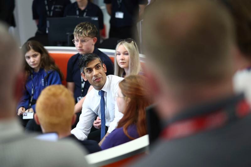Britain's Prime Minister and Conservative Party leader Rishi Sunak, center, takes part in a Q&A session with students and staff at Cannock College, in Cannock, central England, Friday May 24, 2024, during a campaign event in the build-up to the UK general election on July 4. (Henry Nicholls/Pool via AP)