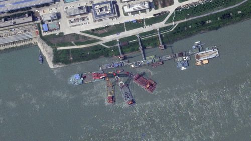 This satellite image from Planet Labs PBC shows what appears to be a sunken Chinese submarine at a shipyard near Wuhan, China, June 15, 2024. (Planet Labs PBC via AP)