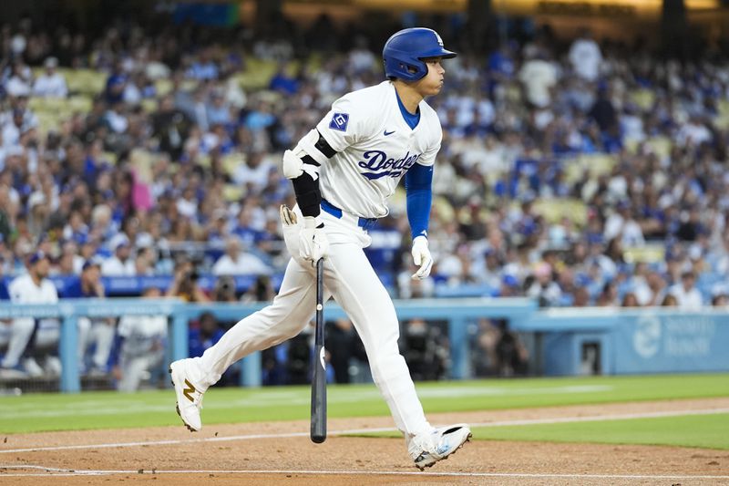 Los Angeles Dodgers designated hitter Shohei Ohtani (17) reacts as he lines out during the first inning of a baseball game against the Tampa Bay Rays in Los Angeles, Friday, Aug. 23, 2024. (AP Photo/Ashley Landis)