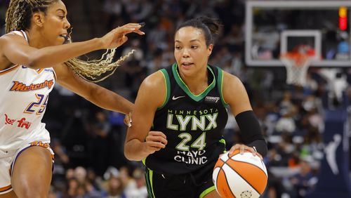 Minnesota Lynx forward Napheesa Collier (24) works around Phoenix Mercury forward Monique Billings, left, in the first quarter of Game 2 of a WNBA basketball first-round playoff game Wednesday, Sept. 25, 2024, in Minneapolis. (AP Photo/Bruce Kluckhohn)