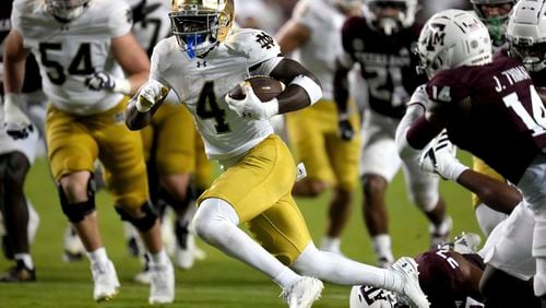 Notre Dame running back Jeremiyah Love (4) breaks free from Texas A&M linebacker Daymion Sanford (27) for a touchdown late in the fourth quarter of an NCAA college football game Saturday, Aug. 31, 2024, in College Station, Texas. (AP Photo/Sam Craft)