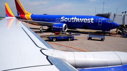 A Southwest Airlines Boeing 737 passenger jet sits at a gate at the Tulsa International Airport Saturday, June 15, 2024, in Tulsa. (AP Photo/Charles Rex Arbogast)