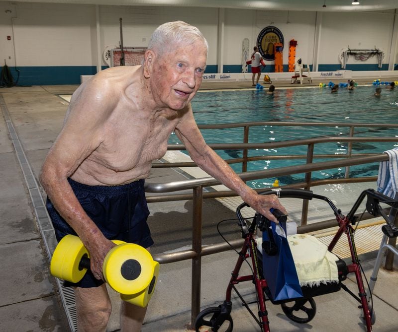 A 104-year-old WWII veteran, Charlie Duncan does water aerobics three days a week at the Mountain View Aquatic Center in east Cobb. PHIL SKINNER FOR THE ATLANTA JOURNAL-CONSTITUTION
 