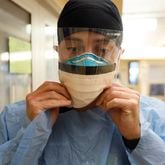 Northeast Georgia Medical Center registered nurse Dylan Glass is fully masked up as he prepares to provide medical care to patients infected with COVID-19 back in February.
Photo by Miguel Martinez /miguel.martinezjimenez@ajc.com