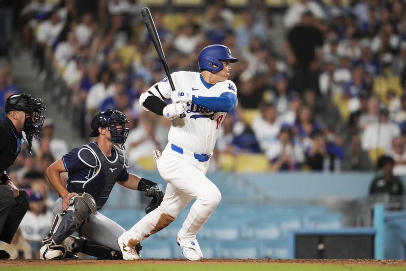 Los Angeles Dodgers designated hitter Shohei Ohtani (17) grounds out during the fifth inning of a baseball game in Los Angeles, Friday, Aug. 23, 2024. (AP Photo/Ashley Landis)