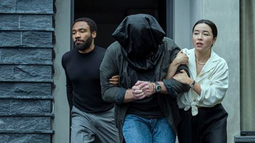 Donald Glover, left, and Maya Erskine in a scene from "Mr. and Mrs. Smith." Glover received two Emmy nominations for the show on Wednesday. (David Lee/Prime Video via AP)