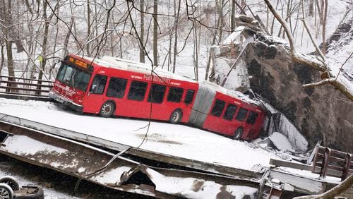 FILE—A Pittsburgh Transit Authority bus sits on the Fern Hollow Bridge in Pittsburgh after it collapsed in this on Jan. 28, 2022. (AP Photo/Gene J. Puskar, File)