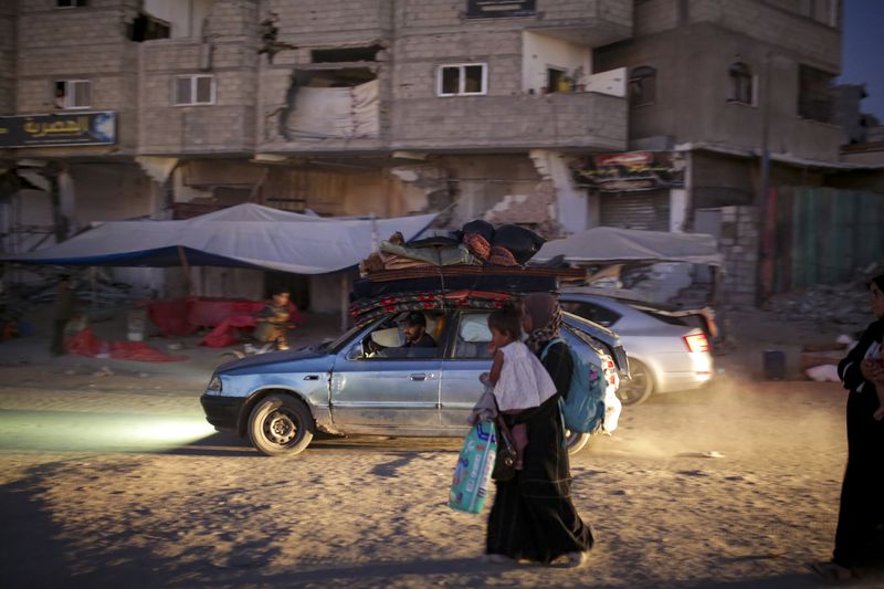 Palestinians displaced by the Israeli air and ground offensive on the Gaza Strip flee from parts of Khan Younis following an evacuation order by the Israeli army to leave the eastern part of Gaza Strip's second largest city on Monday, July 1, 2024. (AP Photo/Jehad Alshrafi)