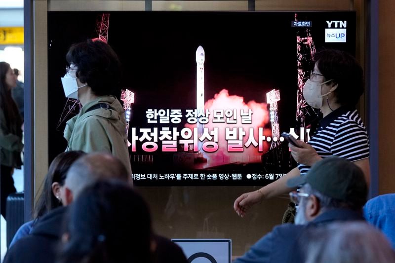 A news program broadcasts a file image of a rocket launch by North Korea, at the Seoul Railway Station in Seoul, South Korea, Tuesday, May 28, 2024. A rocket launched by North Korea to deploy the country's second spy satellite exploded shortly after liftoff Monday, state media reported, in a setback for leader Kim Jong Un's hopes to field satellites to monitor the U.S. and South Korea. The writing on the screen reads "A North Korea spy satellite launch failed on a day when the leaders of South Korea, Japan and China gather." (AP Photo/Ahn Young-joon)