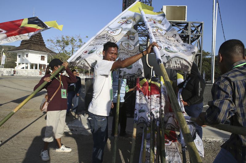 Volunteers prepare to welcome Pope Francis in Dili, East Timor Tuesday, Sept. 3, 2024. (AP Photo/Firdia Lisnawati)